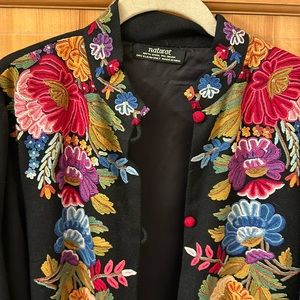 Gorgeous and colorful black coat with intricate stitching in flower designs